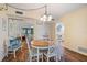 Cozy dining area with wood floors, a round table with chairs, and plenty of natural light at 612 Bird Bay S Dr # 311, Venice, FL 34285