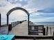 View of Venice Fishing Pier on a clear day, showcasing the pier's entrance, railings, and ocean views at 616 Guild Dr # 2, Venice, FL 34285