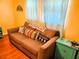 Comfortable living room with a couch decorated with colorful pillows at 616 Guild Dr # 2, Venice, FL 34285