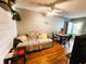 Comfortable living room featuring a sofa, round dining table and wood-look flooring at 616 Guild Dr # 2, Venice, FL 34285