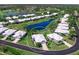 Scenic aerial home view amidst the pond and golf course, surrounded by beautiful homes at 643 Crossfield Cir # 13, Venice, FL 34293