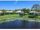 Great house, nice lawn, and waterfront view from the back at 643 Crossfield Cir # 13, Venice, FL 34293