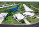 Aerial shot of beautiful home with lush landscaping, and a pristine roof at 643 Crossfield Cir # 13, Venice, FL 34293