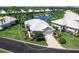 Beautiful aerial view of well-kept home showing landscaping, and paved driveway at 643 Crossfield Cir # 13, Venice, FL 34293