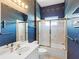 Bathroom with single sink vanity, tile floors, and shower and tub combo at 643 Crossfield Cir # 13, Venice, FL 34293