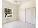 Bedroom offers a neutral color scheme, closet and tile floors throughout at 643 Crossfield Cir # 13, Venice, FL 34293