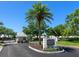 Community entrance sign surrounded by lush landscaping, marking the entry to Saint George at 643 Crossfield Cir # 13, Venice, FL 34293
