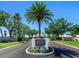 Community entrance sign surrounded by lush landscaping, marking the entry to Saint George at 643 Crossfield Cir # 13, Venice, FL 34293