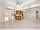 Open-concept living space with tile flooring and a mirrored wall at 643 Crossfield Cir # 13, Venice, FL 34293