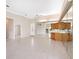 Spacious living area featuring tiled floors, a mirrored wall, and a seamless flow at 643 Crossfield Cir # 13, Venice, FL 34293