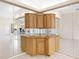 Unique bar in an open floor plan with tile flooring and mirrored accents at 643 Crossfield Cir # 13, Venice, FL 34293