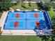 Overhead view of the community's well-maintained pickleball courts, ready for a friendly match at 643 Crossfield Cir # 13, Venice, FL 34293
