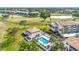 Beautiful aerial view overlooking community pool, golf course, and pond at 839 Wexford Blvd # 839, Venice, FL 34293