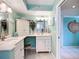 Bright bathroom featuring double sinks, vanity space, and tiled floors, offering a functional and stylish design at 839 Wexford Blvd # 839, Venice, FL 34293