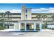 Entrance to a well-maintained multi-story condo building with covered area at 839 Wexford Blvd # 839, Venice, FL 34293