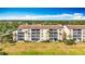 Rear exterior of a multi-story condo building with screened lanais at 839 Wexford Blvd # 839, Venice, FL 34293