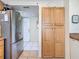 Kitchen view with stainless steel refrigerator and pantry at 839 Wexford Blvd # 839, Venice, FL 34293