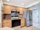 Well-equipped kitchen features stainless steel refrigerator and ample cabinet storage at 839 Wexford Blvd # 839, Venice, FL 34293