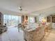 Bright living room with patio access and neutral decor and tones at 839 Wexford Blvd # 839, Venice, FL 34293