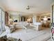 Spacious living room with mirror wall feature and an open floor plan at 839 Wexford Blvd # 839, Venice, FL 34293
