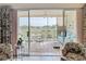 Screened patio with metal chairs, a small table, and a view of a golf course at 839 Wexford Blvd # 839, Venice, FL 34293