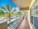 Exterior walkway with palm tree views and railing at 839 Wexford Blvd # 839, Venice, FL 34293