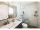 Modern bathroom with a sleek vanity, updated fixtures, and a luxurious glass-enclosed shower at 8432 Culebra Ave, North Port, FL 34287