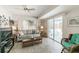 Cozy living room with a sliding door to the outside and a comfortable seating area at 8432 Culebra Ave, North Port, FL 34287
