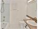 Cozy bathroom featuring a tiled shower, vanity with sink, and patterned tile flooring at 846 Senda Plata # 26, Venice, FL 34293
