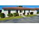 Charming single-story villa with a red tile roof, tidy landscaping, and an attached one car garage under a bright blue sky at 846 Senda Plata # 26, Venice, FL 34293