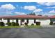 Charming single-story villa with a red tile roof, tidy landscaping, and an attached one car garage under a bright blue sky at 846 Senda Plata # 26, Venice, FL 34293