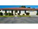 Inviting single-story villa with a red tile roof, well-maintained lawn, and attached garage at 846 Senda Plata # 26, Venice, FL 34293
