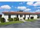 Charming single-story villa with a red tile roof, tidy landscaping, and an attached one car garage under a bright blue sky at 846 Senda Plata # 26, Venice, FL 34293