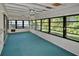 Relaxing sun room with multiple windows and ceiling fans and beadboard walls at 846 Senda Plata # 26, Venice, FL 34293