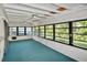 Relaxing sun room with multiple windows and ceiling fans and beadboard walls at 846 Senda Plata # 26, Venice, FL 34293