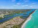 Stunning aerial view showcasing the beautiful Gulf Coast, inland waterway, and the South Venice Beach Ferry at 863 Southland Rd, Venice, FL 34293