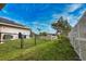 Fenced backyard, showing solar panels on roof at 863 Southland Rd, Venice, FL 34293