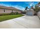Driveway view of the house and shed at 863 Southland Rd, Venice, FL 34293