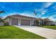 This beautiful single-Gathering home features a well-manicured lawn and a spacious driveway at 863 Southland Rd, Venice, FL 34293