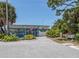 View of the South Venice Beach Ferry landing with shady foliage and a seating area for people who are waiting at 863 Southland Rd, Venice, FL 34293