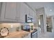 Modern kitchen design features stainless steel appliances, tile backsplash, and ample counter space at 863 Southland Rd, Venice, FL 34293
