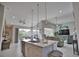 Open concept kitchen with island and a seamless flow to living and dining areas at 863 Southland Rd, Venice, FL 34293