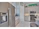 Modern kitchen with stainless steel appliances, ample cabinet space, and stylish backsplash at 863 Southland Rd, Venice, FL 34293