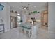 Bright kitchen features a large island, stainless steel appliances, and ample counter space at 863 Southland Rd, Venice, FL 34293