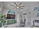 Inviting living room featuring a ceiling fan, comfortable seating, and modern decor with an open concept design at 863 Southland Rd, Venice, FL 34293