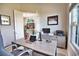 Comfortable and functional home office with a modern desk, ample storage, and views of the living room and television at 863 Southland Rd, Venice, FL 34293