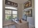 Stylish home office features a modern desk, comfortable chair, and window with a view at 863 Southland Rd, Venice, FL 34293
