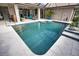 Beautiful backyard pool with tiled surround and blue tile accents, easy access to the house and outdoor shower at 863 Southland Rd, Venice, FL 34293