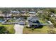 An aerial shot showcasing the home, its spacious yard, and surrounding neighborhood at 915 Citrus Rd, Venice, FL 34293
