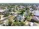 An aerial view showcases the home's backyard and patio in a scenic neighborhood setting at 915 Citrus Rd, Venice, FL 34293